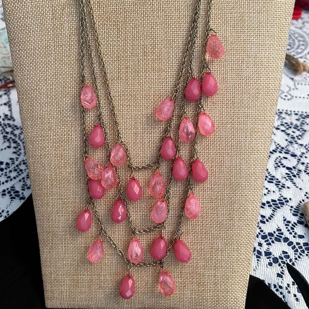 Pink coral teardrop beads w/ goldtone three cascading layered chains.